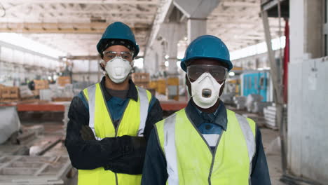 men wearing protective gear in factory