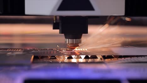 CNC-Laser-cutting-of-metal-in-slow-motion,-modern-industrial-technology.