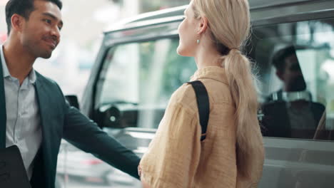 woman getting into a car