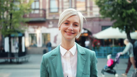 smiling business woman in green blazer