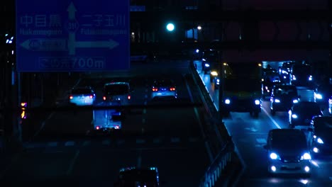 a night timelapse of the traffic jam at the city street in tokyo long shot