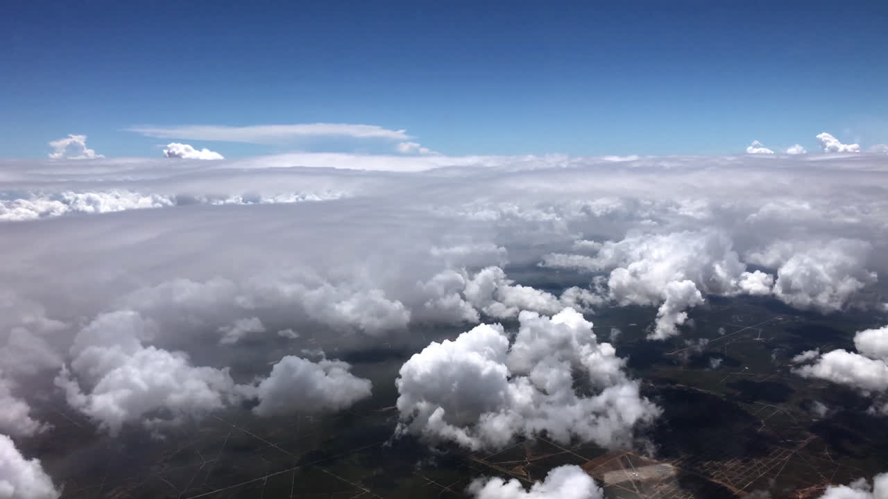 Aerial View of Fluffy White Clouds and Blue Sky