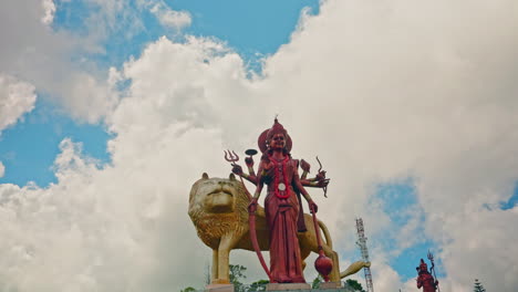 high statue of shiva goddess with a golden lion