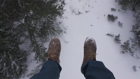 pov looking at feet boots dangling going up ski lift in slovakia