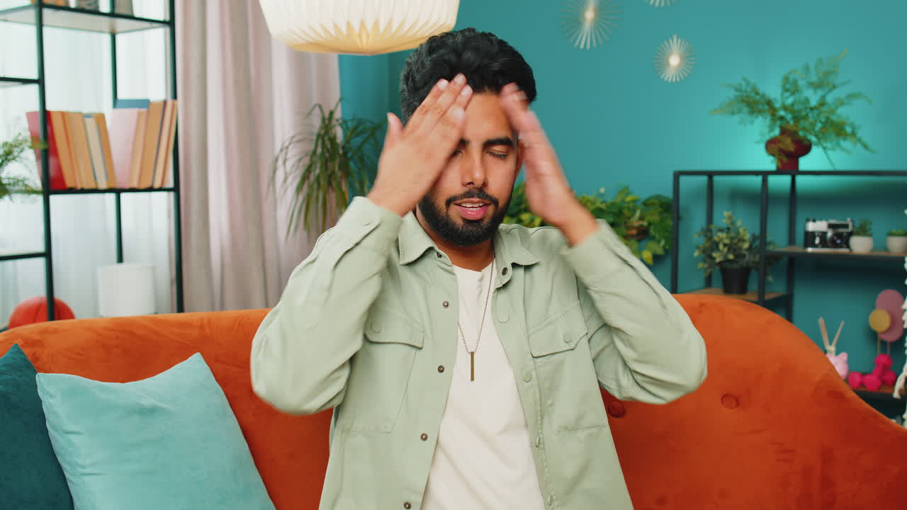 Upset sad Indian man making face palm gesture, feeling bored, disappointed in fail bad results news