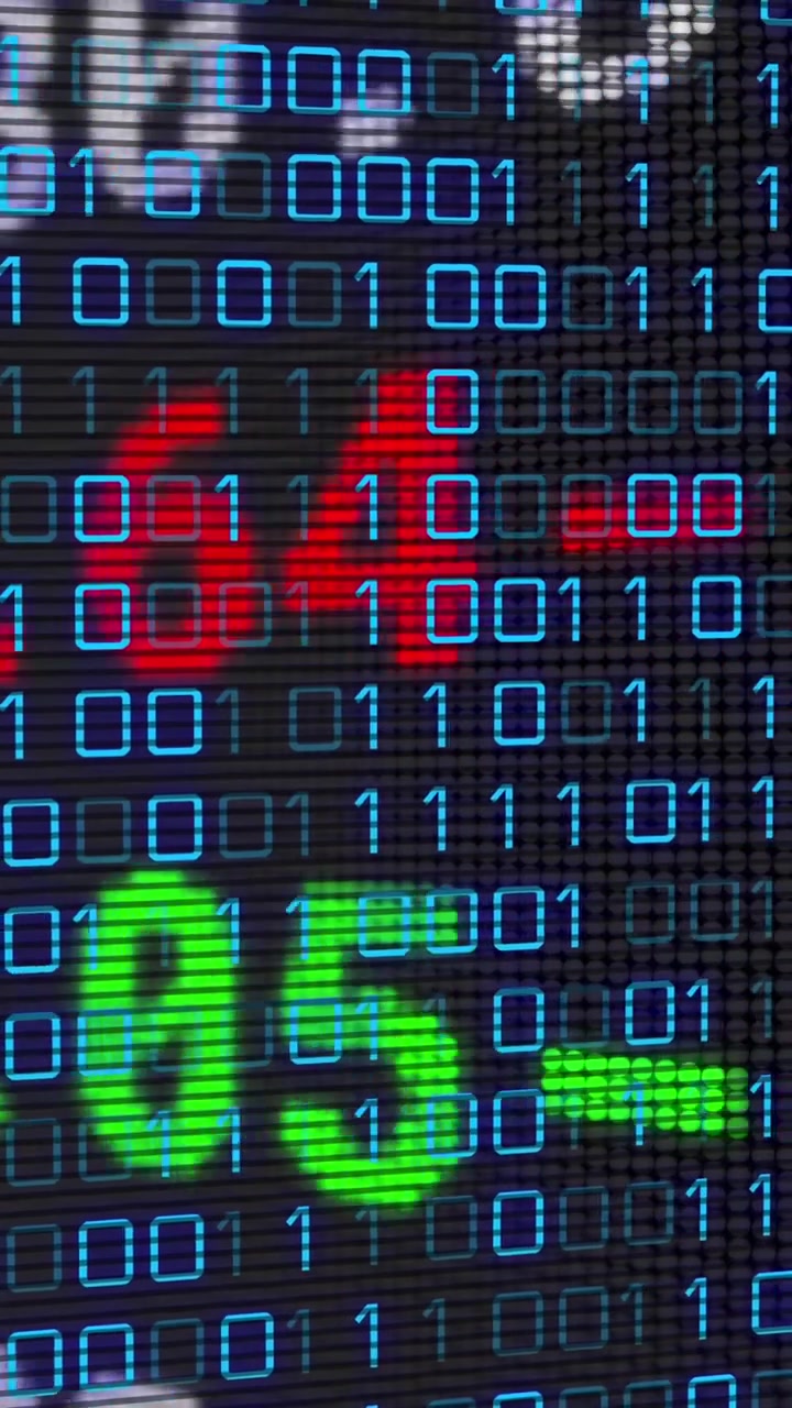 Animation of financial data over binary code on black background