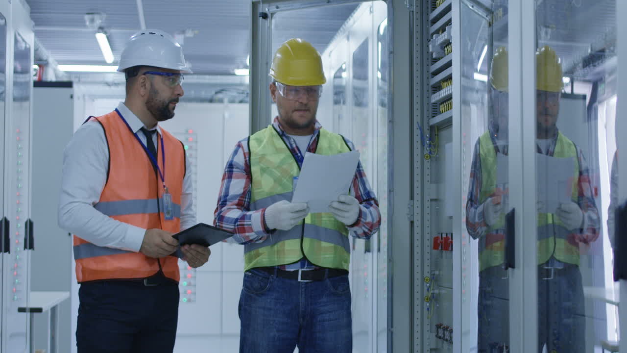 Engineers Inspecting Equipment in a Data Center