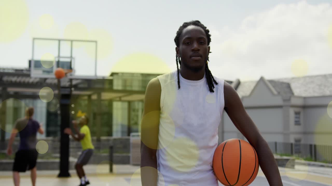 Sun moving brightening court bokeh flares spotlighting player practicing basketball pickup drill