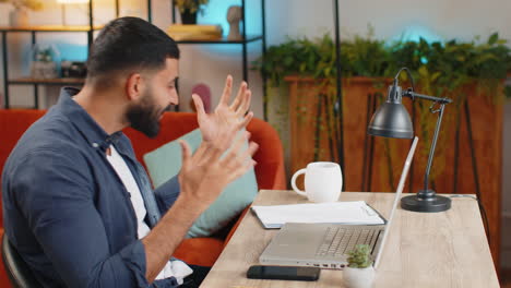 Happy-amazed-Indian-man-working-on-laptop-celebrate-game-winning-thumbs-up-good-career-business-news