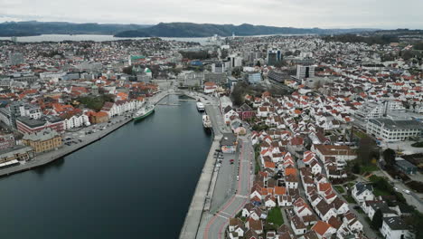 drone view over historic district of stavanger with quaint white wooden cottages