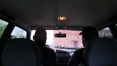 two men in a car