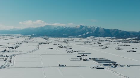 Snow-Covered Landscape Of Nakafurano Town During Winter In Hokkaido, Japan. Aerial Drone Shot