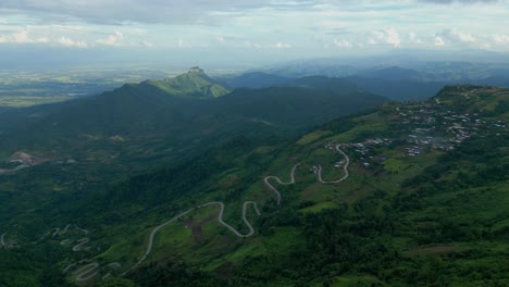 Aerial-view-of-mountain-winding-road-with-beautiful-sky