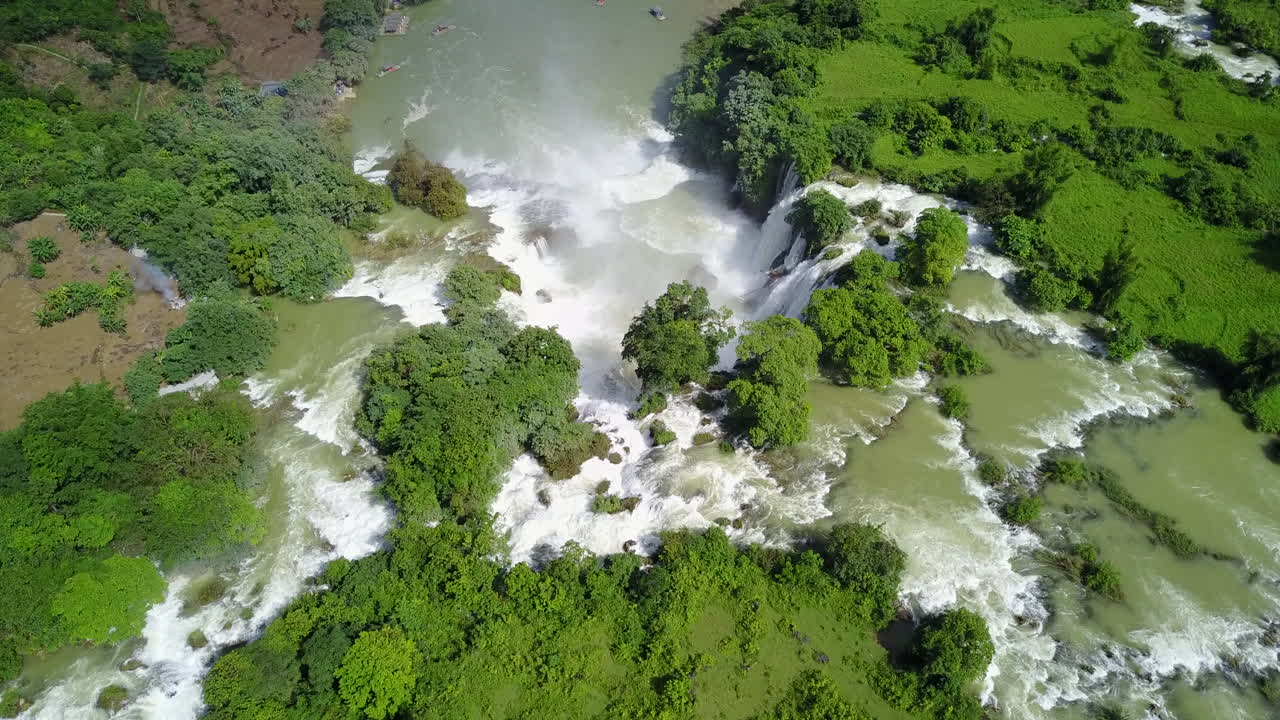 Aerial view of Ban Gioc Waterfalls in lush greenery and rushing waters