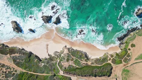 praia de samoqueira beach in alentejo, portugal on a sunny day, aerial view