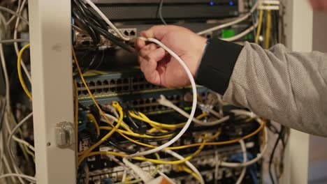 technician configures the network equipment in the server room