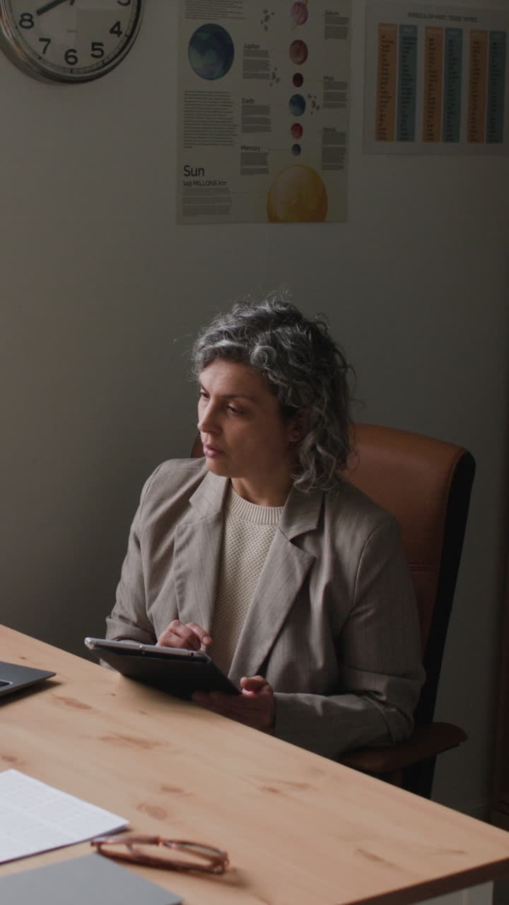 Woman working on tablet in an office