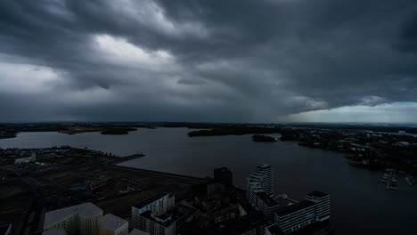 time lapse of dark rain clouds rolling over the sea and east helsinki, finland