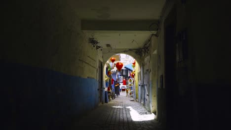 shopkeeper hanging lanterns