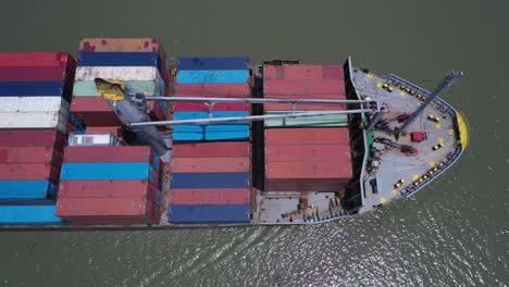 Top-down-aerial-view-of-a-large-container-ship-on-a-sunny-day