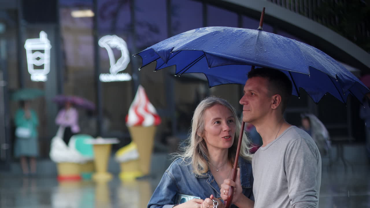 Couple under an umbrella in the rain