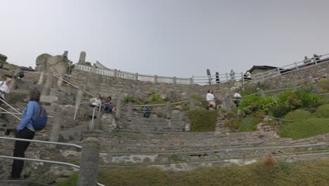 people exploring the minack theatre outdoor stone amphitheater