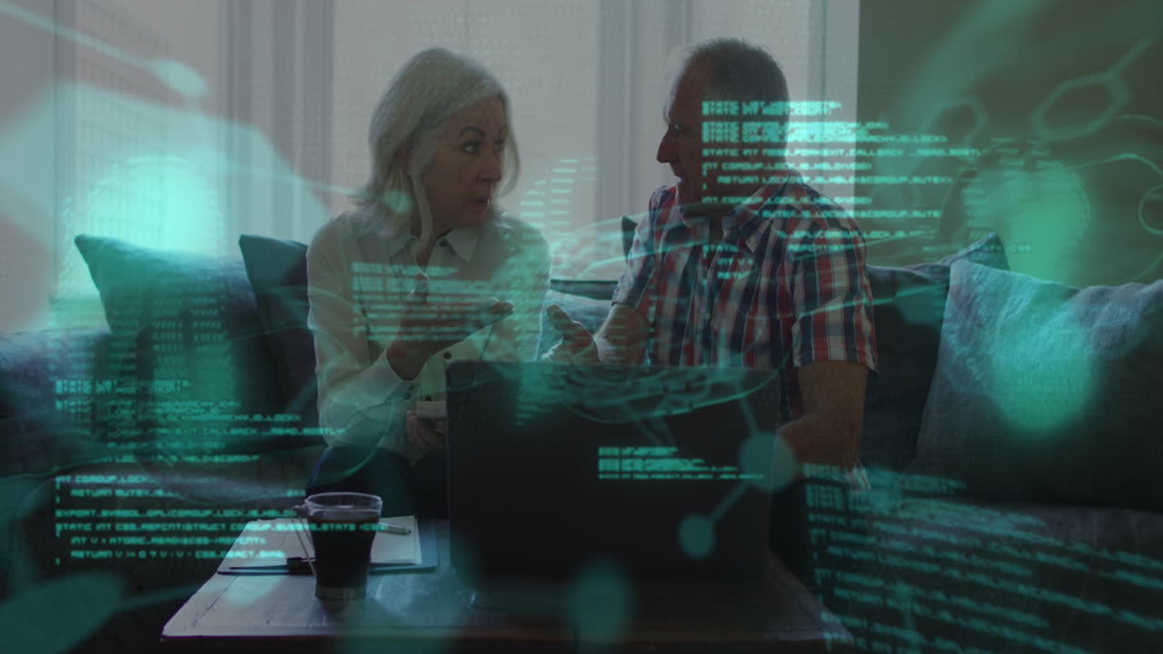 Animation of data processing over senior caucasian couple using laptop