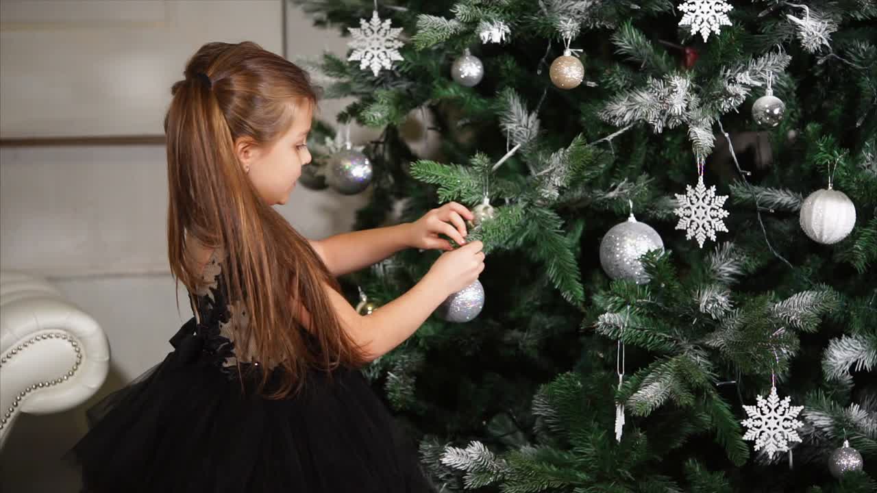 Girl Decorating Christmas Tree