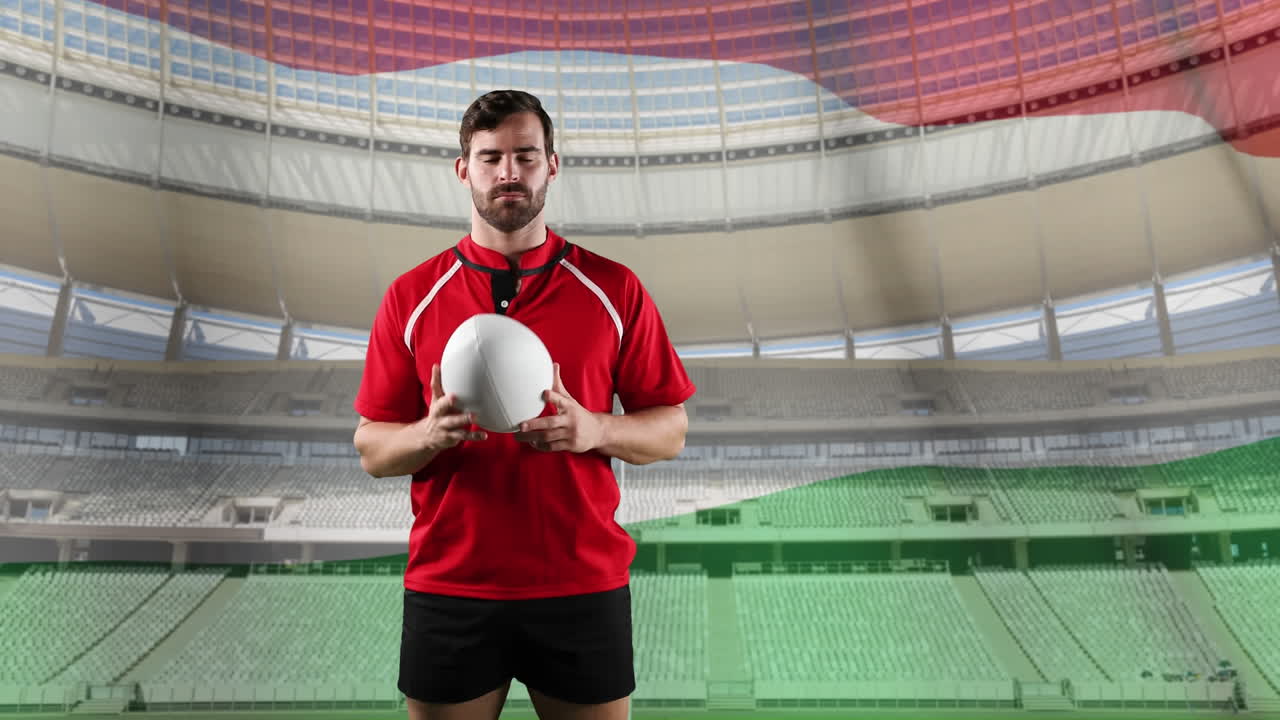 프로 럭비 선수 가  ⁇ 발 과 경기장 앞 에 서 있다