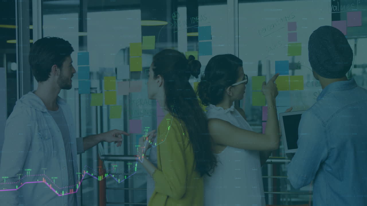 Diverse team collaborating on project with stock market data animation overlay