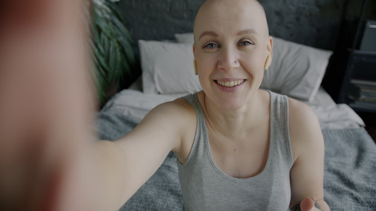 Selfie of pregnant woman and woman with bald head