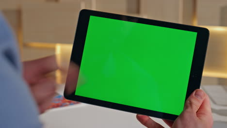 entrepreneur using mockup tablet for online work in home office close up.