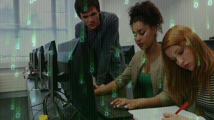 Binary code animation over diverse people working on computers in office