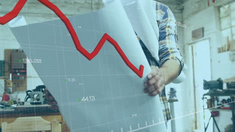 animation of red graph processing over mature caucasian male carpenter with blueprints in workshop