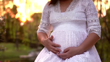 Pregnant-woman-feeling-happy-at-garden-home.