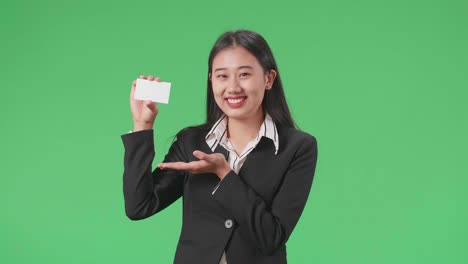 businesswoman presenting a blank business card
