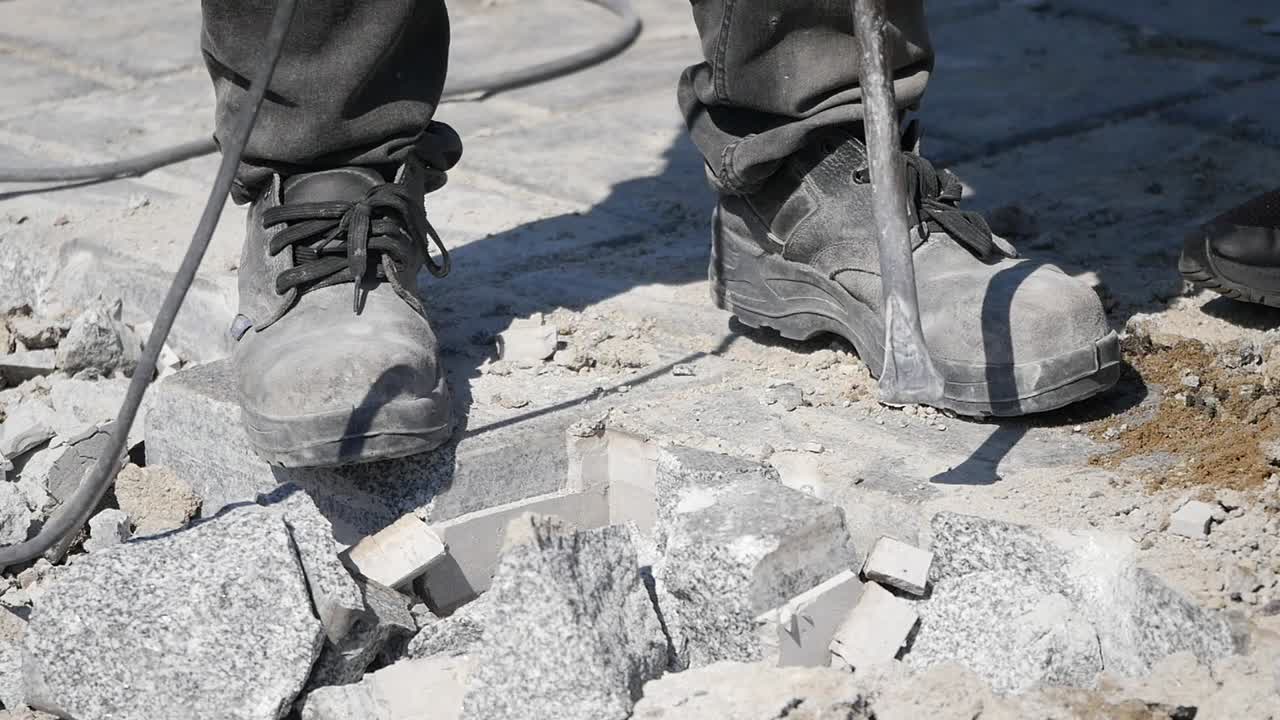 Demolishing a Paving Stone with a Jackhammer