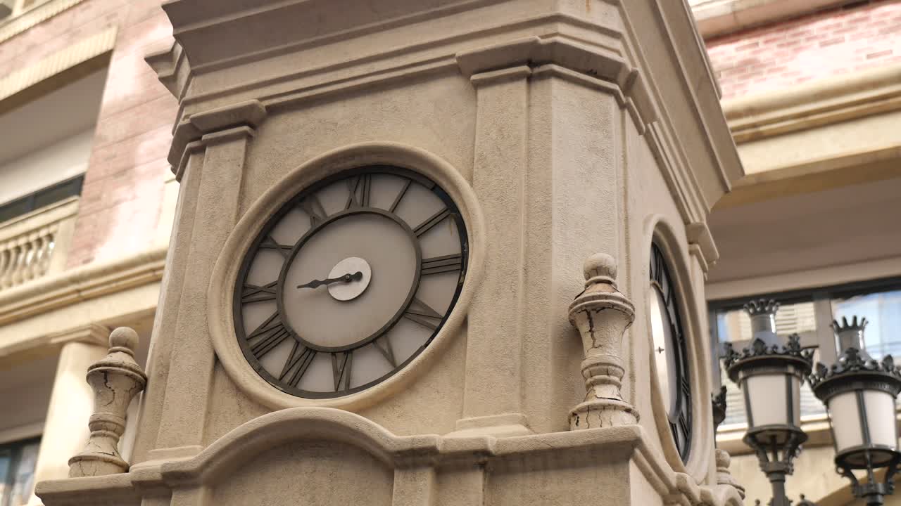 Close-up of a Historic Stone Clock Tower with Roman Numerals