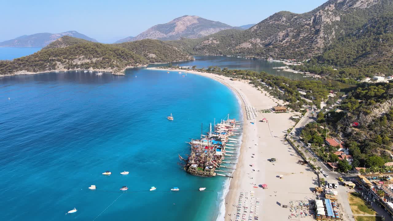 Filming from a drone pirate yachts moored on the shore against the background of a mountain landscape in the city of Dalyan Turkey