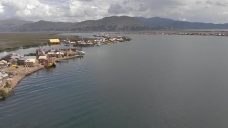 aerial: unique tourist experience of uros floating islands on titicaca