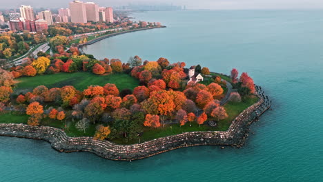 aerial tracking shot of fall foliage at the promontory point of chicago, usa