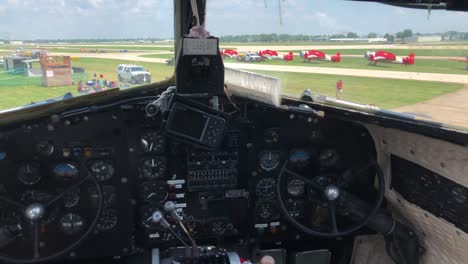 cockpit of vintage airliner on ground