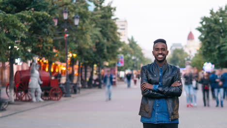 man standing on a city street