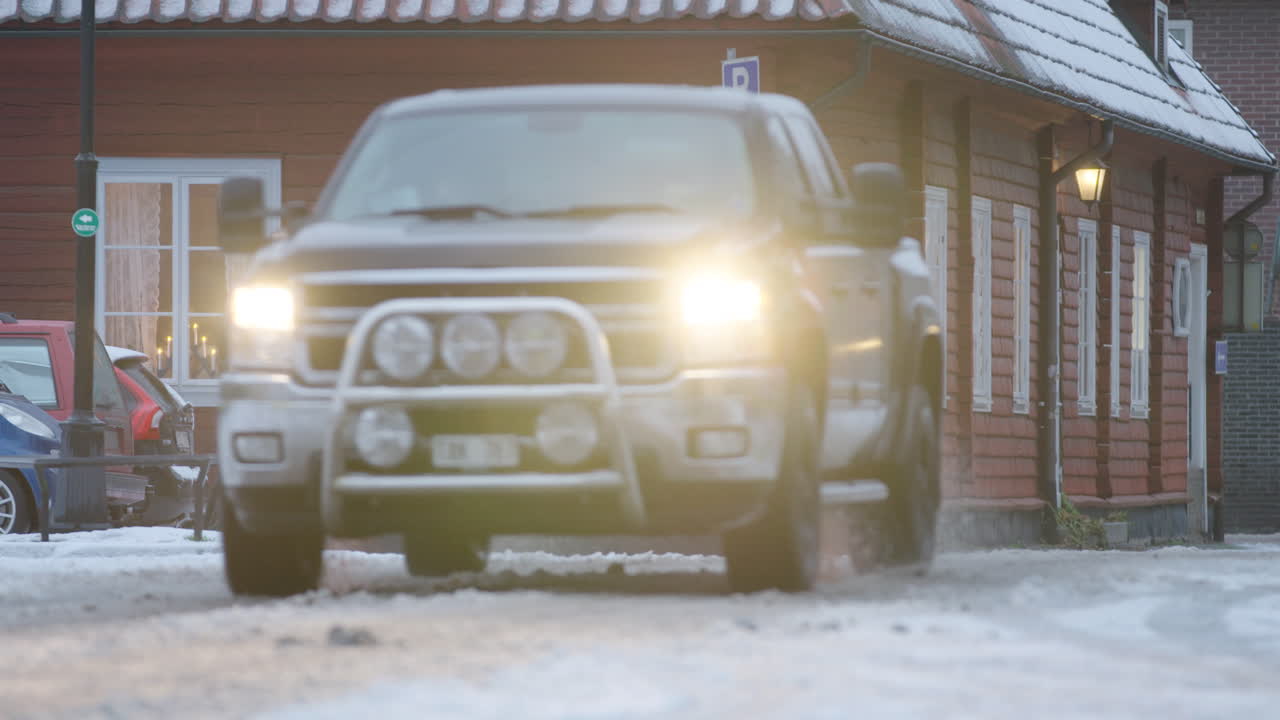 Advent candles in the windows of a traditional Swedish wooden building, during the covid-19 pandemic