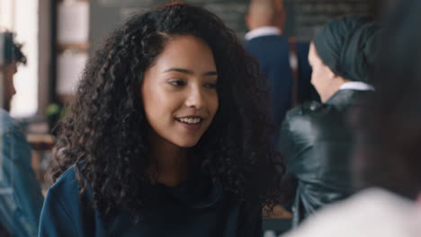 beautiful-teenage-girl-chatting-with-friend-in-cafe-socializing-enjoying-conversation-hanging-out-in-busy-coffee-shop