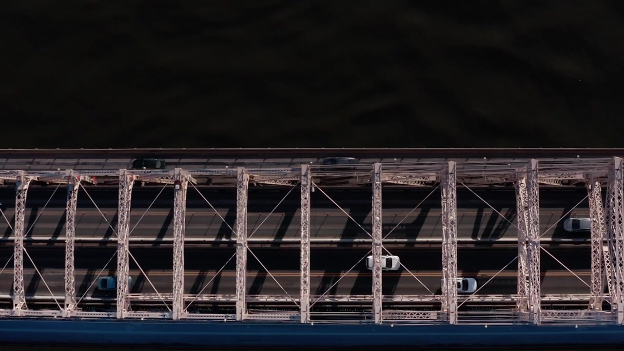 View of a bridge over water in New York during daytime with traffic