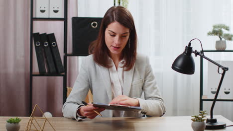 POV-of-business-woman-freelancer-tutor-showing-graphs-during-online-video-call-meeting-at-office