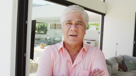 Portrait-of-happy-senior-biracial-man-at-retirement-home