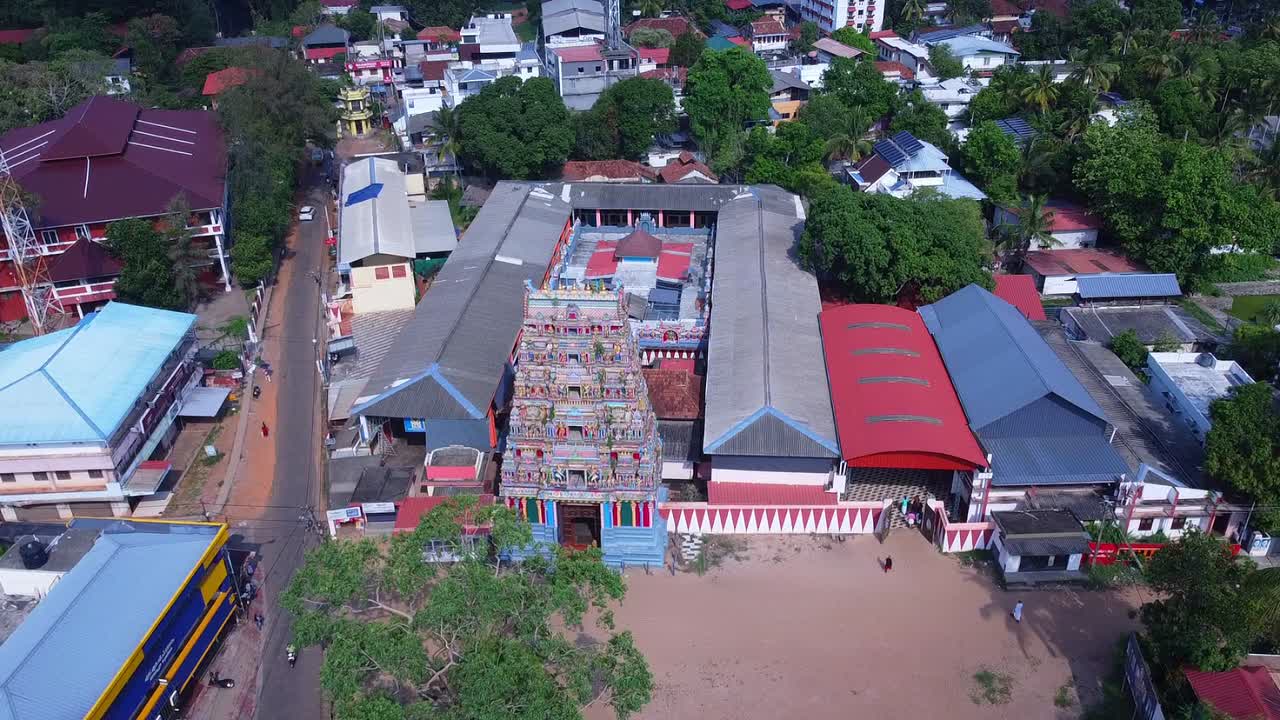 Heavily populated area in Kerala, Trivandrum, India, Temple, Trees in an urban area, road, transportation, culture