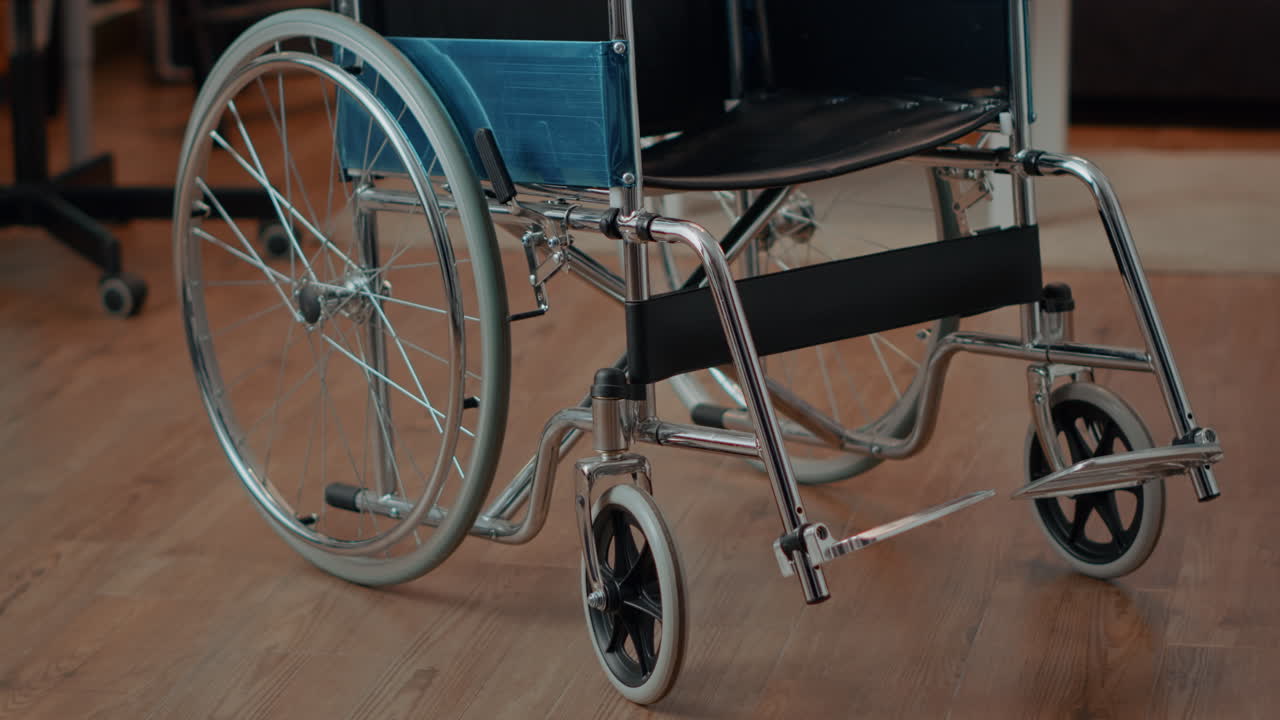 Close-up of a wheelchair on a wood floor
